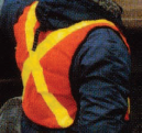 Constructio worker wearing a yellow and orange reflective vest.