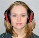 Woman wearing safety ear muffs.